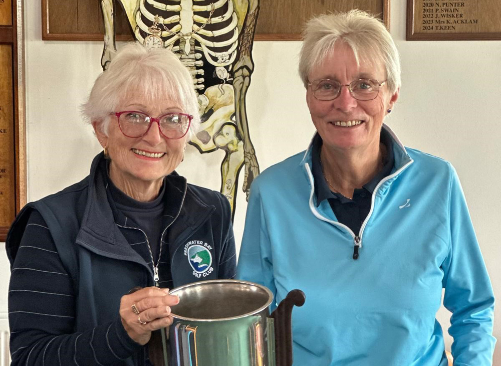 EVITTS AND MORRIS LIFT CHAMPAGNE TROPHY AT FRESHWATER BAY GOLF CLUB