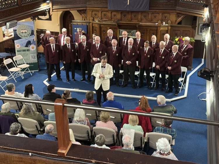 NEWCHURCH MALE VOICE CHOIR RAISES £700 FOR DAISY RING BUS