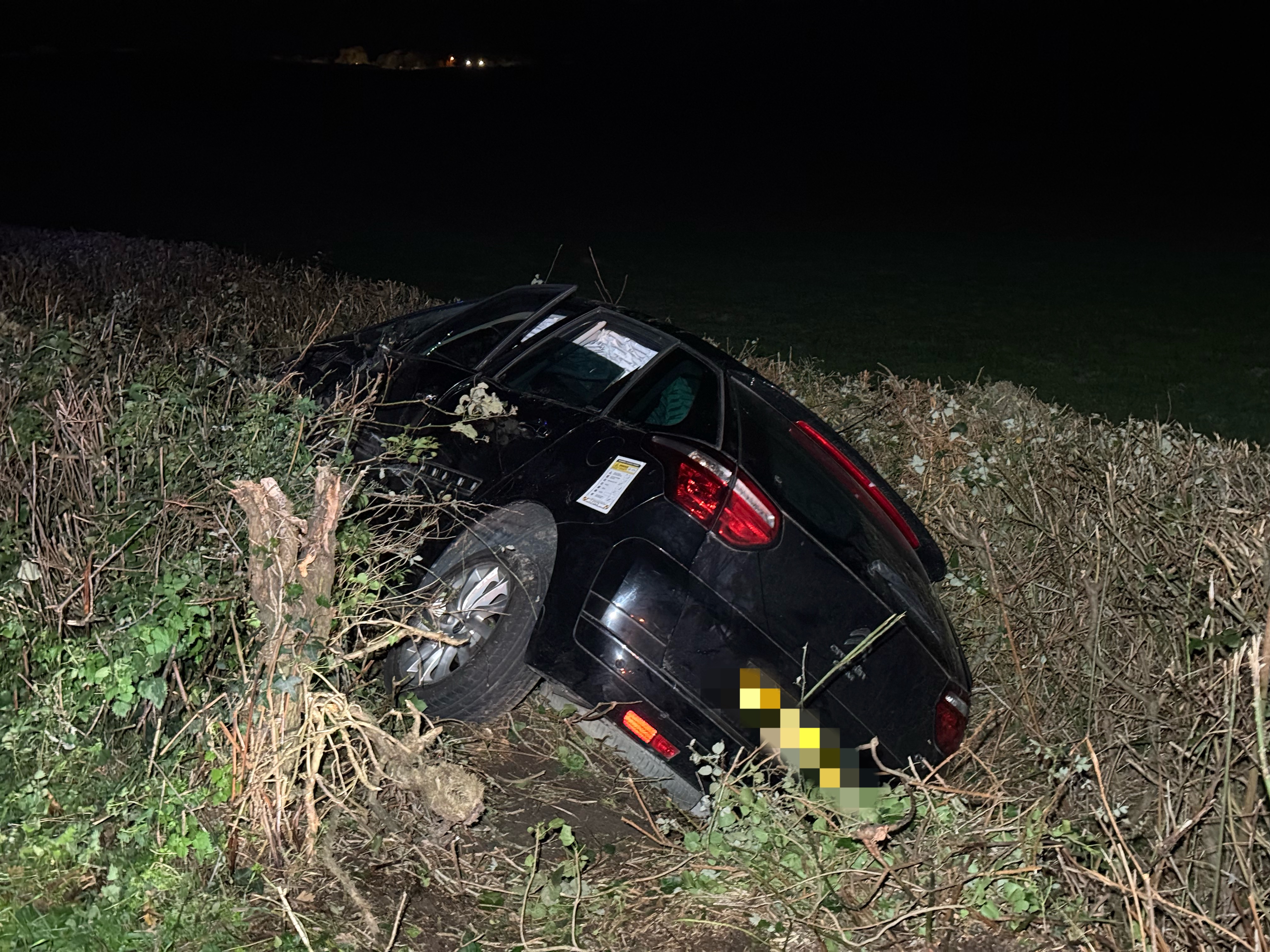 OCCUPANTS TRAPPED AS CAR CAREERS INTO FIELD IN DRAMATIC 2-CAR SMASH
