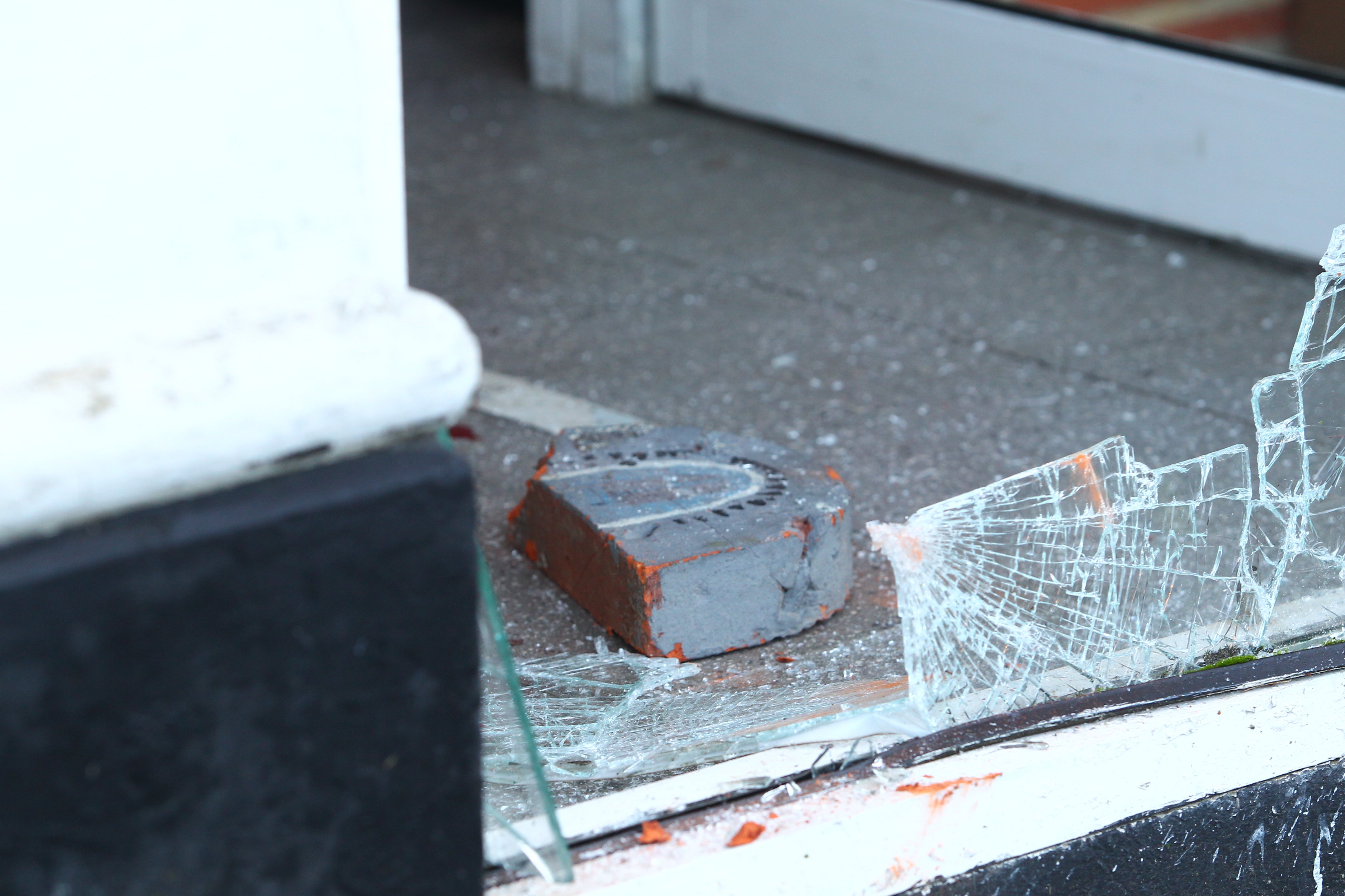 CORDON ERECTED AFTER BRICK PUT THROUGH SHOP WINDOW IN WROXALL