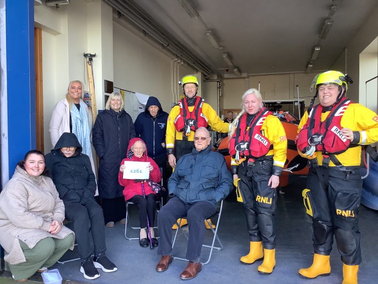RESIDENTS FROM THE ELMS DONATE TO BEMBRIDGE RNLI DURING FESTIVE STATION VISIT