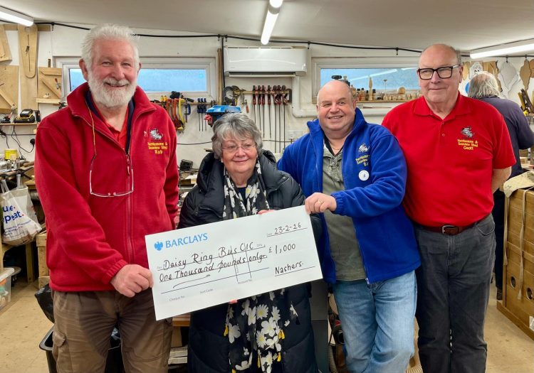 SHED MEMBERS RAISE VITAL FUNDS FOR DAISY RING BUS