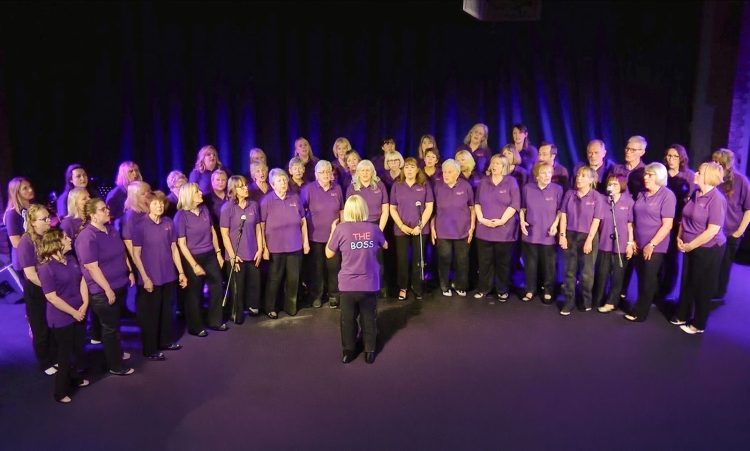 ISLE OF WIGHT TALENT SHINES AS 50-STRONG CHOIR RAISES OVER A GRAND