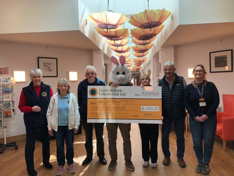 CLASSIC CAR ENTHUSIASTS RAISE £1,000 AT EASTER CHARITY COLLECTION DESPITE POOR WEATHER