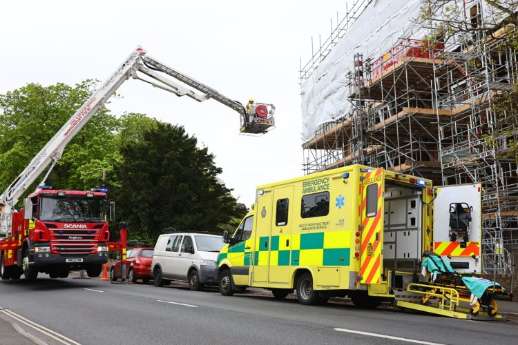 ROAD CLOSED AS AERIAL PLATFORM CALLED IN TO MOVE WOMAN WITH NECK INJURY