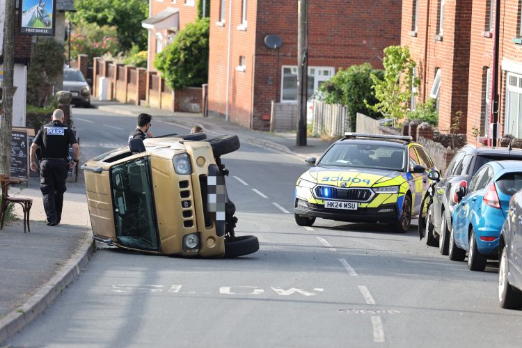 UPDATED: CAR ROLLS ONTO SIDE BLOCKING MAIN ROAD THROUGH WHITWELL