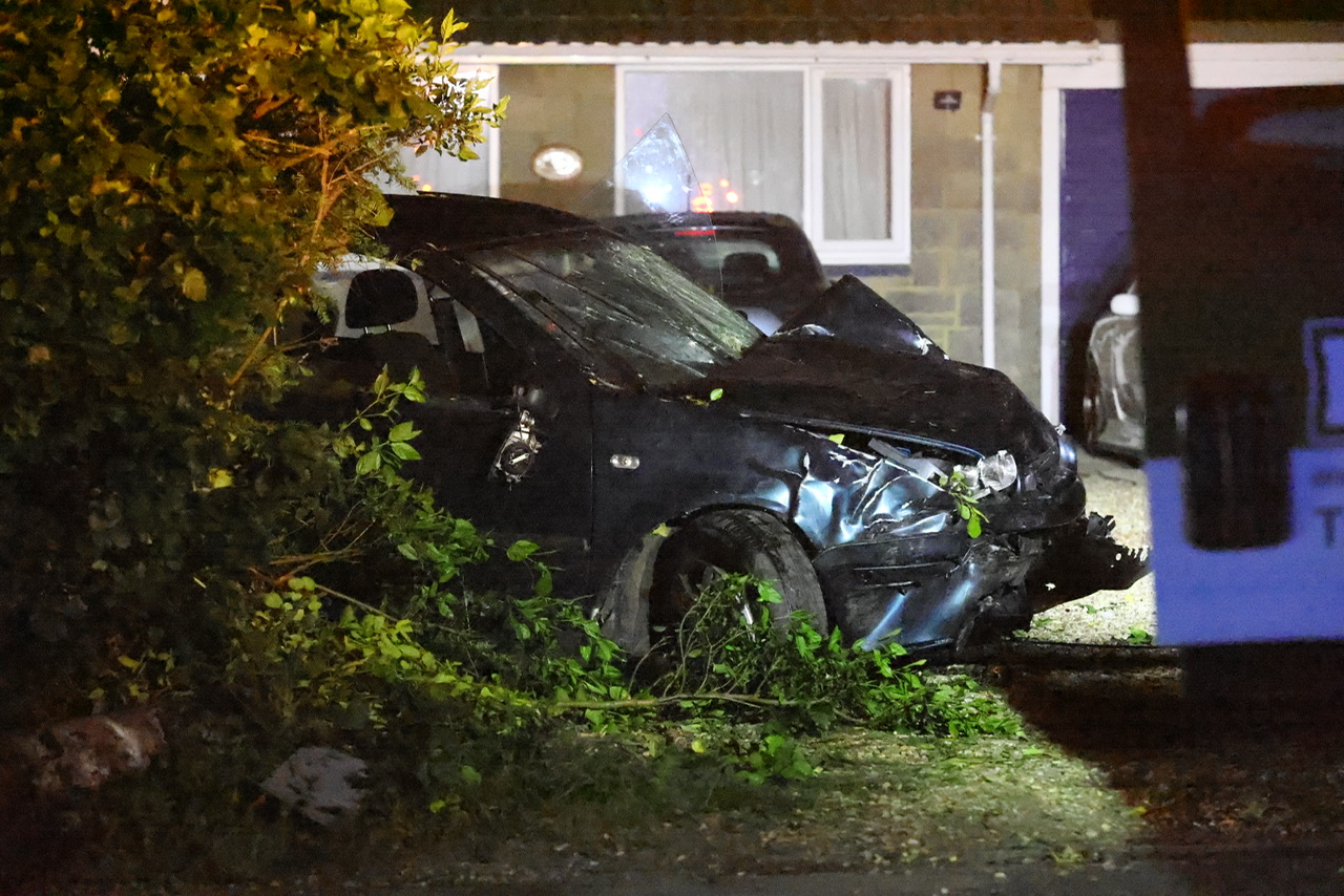 WOMEN ARRESTED AS CAR CAREERS INTO GARDEN AND WIPES OUT LAMP POST