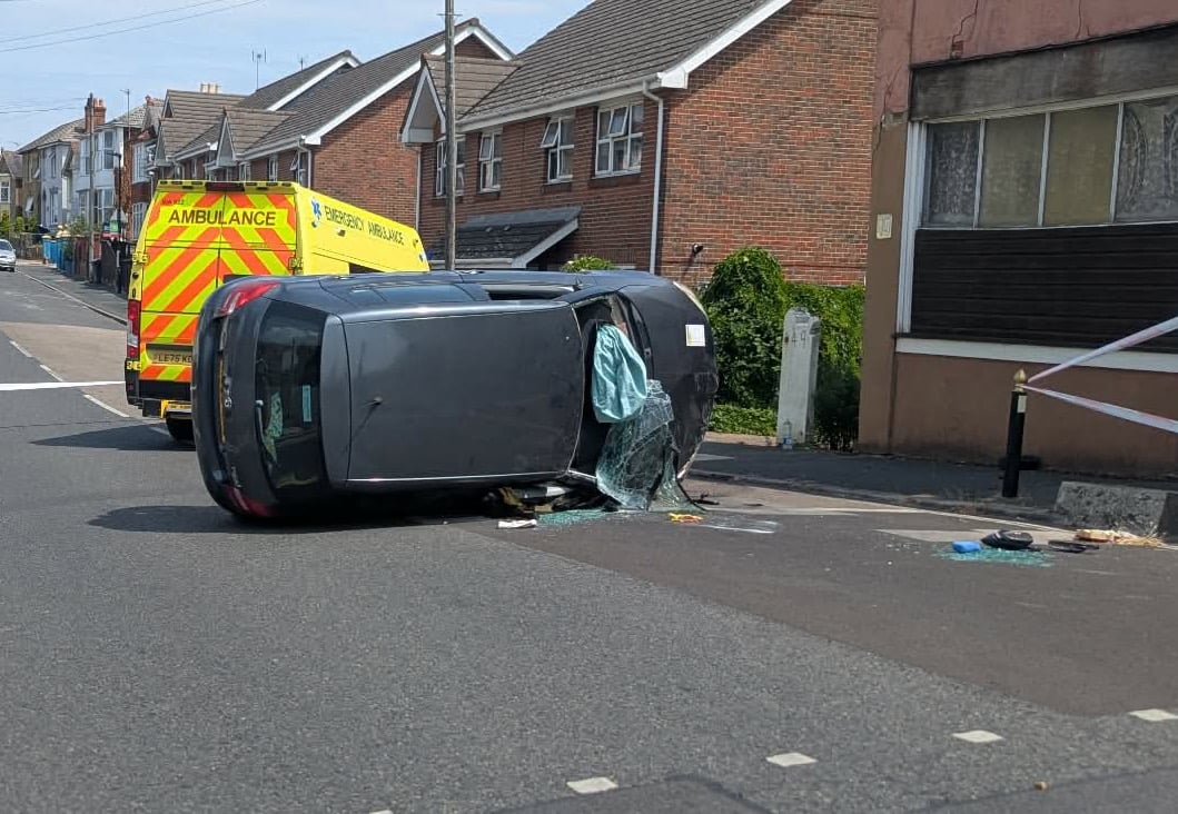 CAR WIPES OUT TRAFFIC LIGHT AND OVERTURNS AT BUSY RYDE JUNCTION