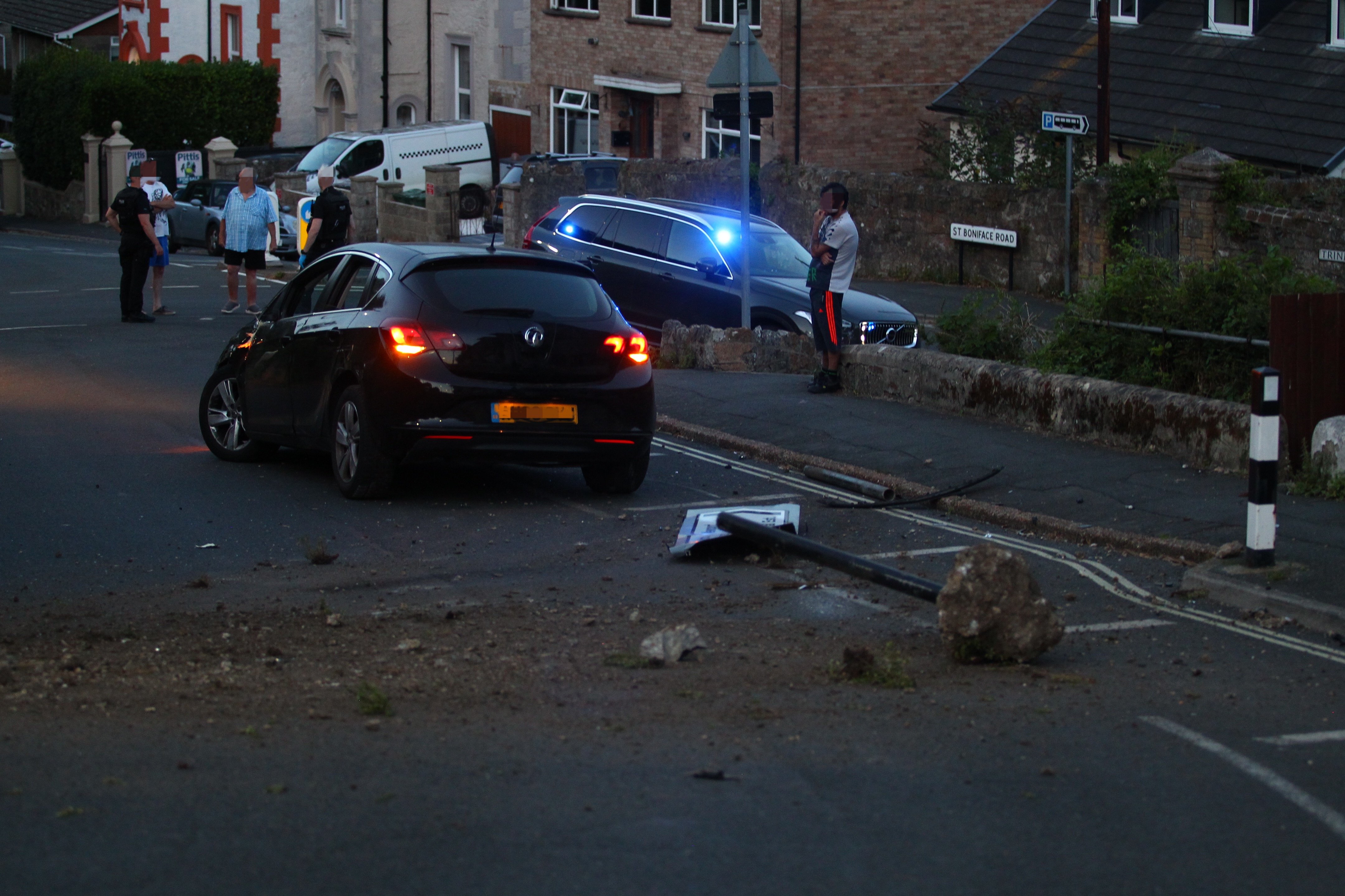 DRIVERS FLEE AFTER CAR HITS SIGN AND SPINS