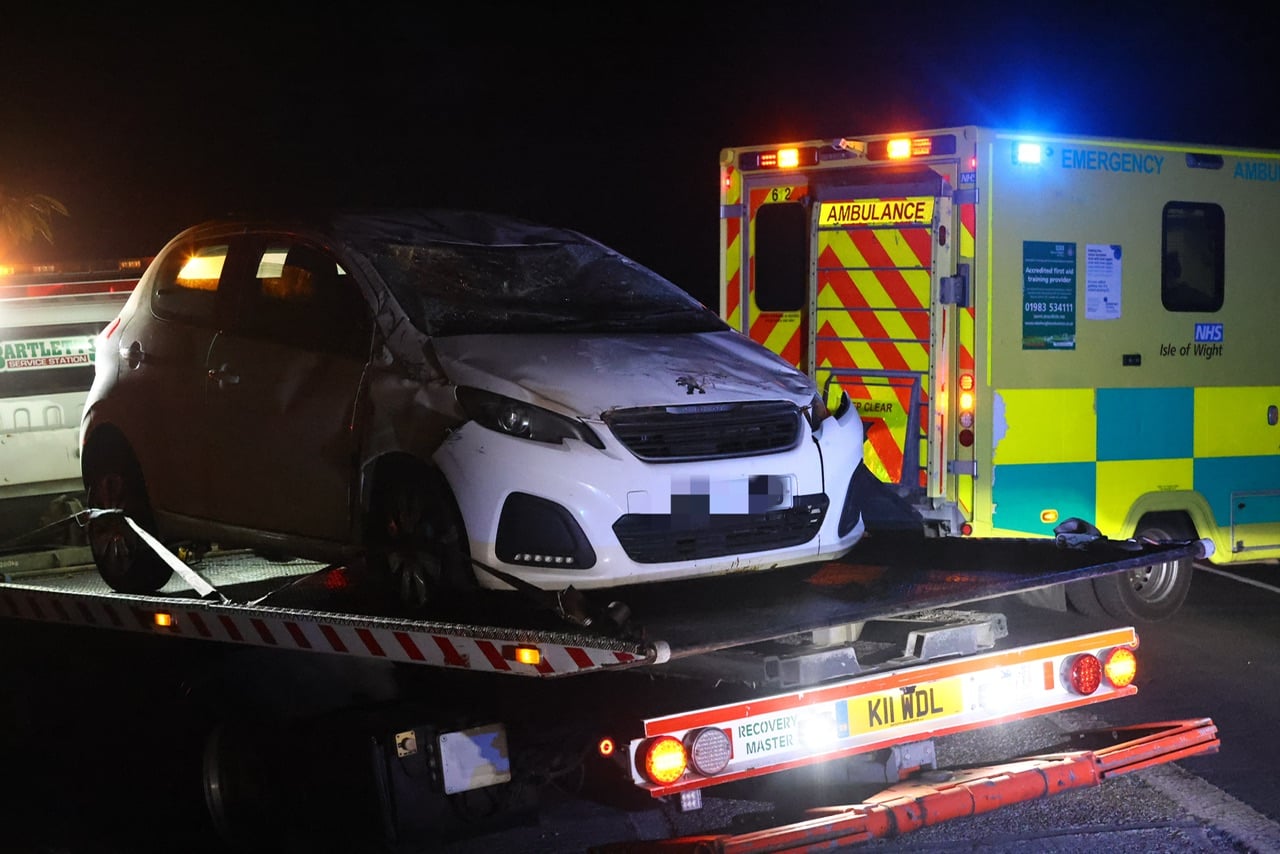 CAR ROLLS ONTO ROOF OUTSIDE POPULAR ISLE OF WIGHT ATTRACTION