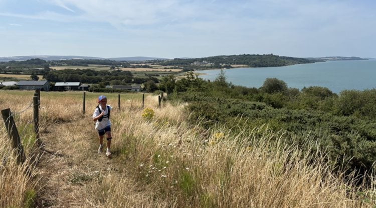 8-YEAR-OLD CHARLIE REACHES HALFWAY POINT OF 70-MILE RNLI COASTAL CHALLENGE