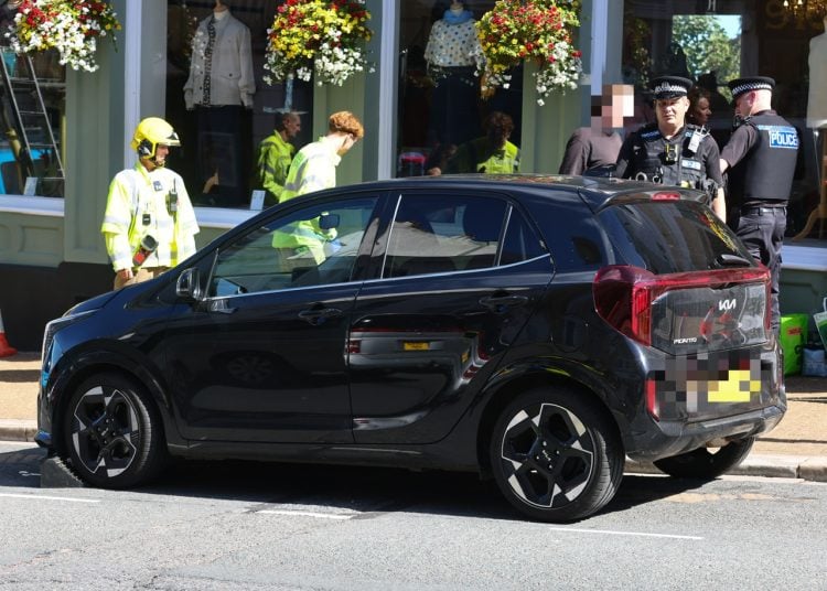 PARKING MISHAP SEES BRAND NEW KIA MOUNT PAVEMENT AND CRASH INTO RYDE SHOP