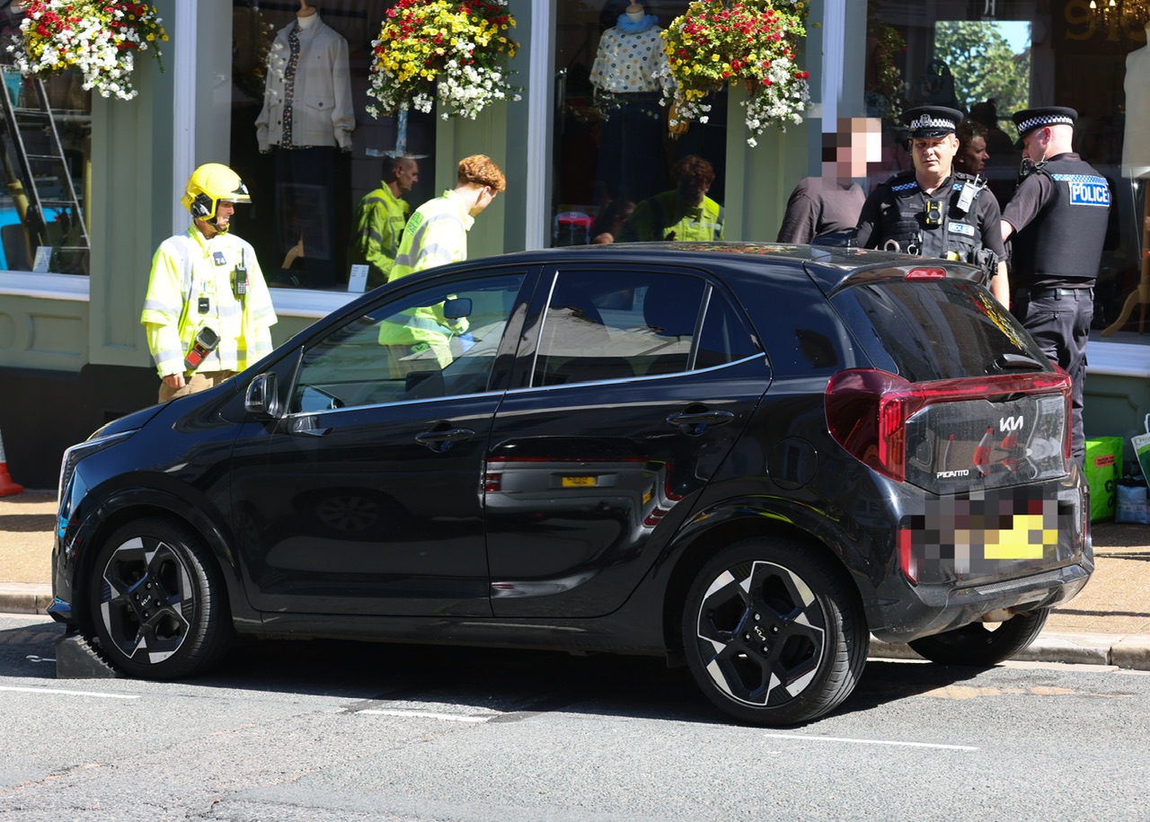 PARKING MISHAP SEES BRAND NEW KIA MOUNT PAVEMENT AND CRASH INTO RYDE SHOP