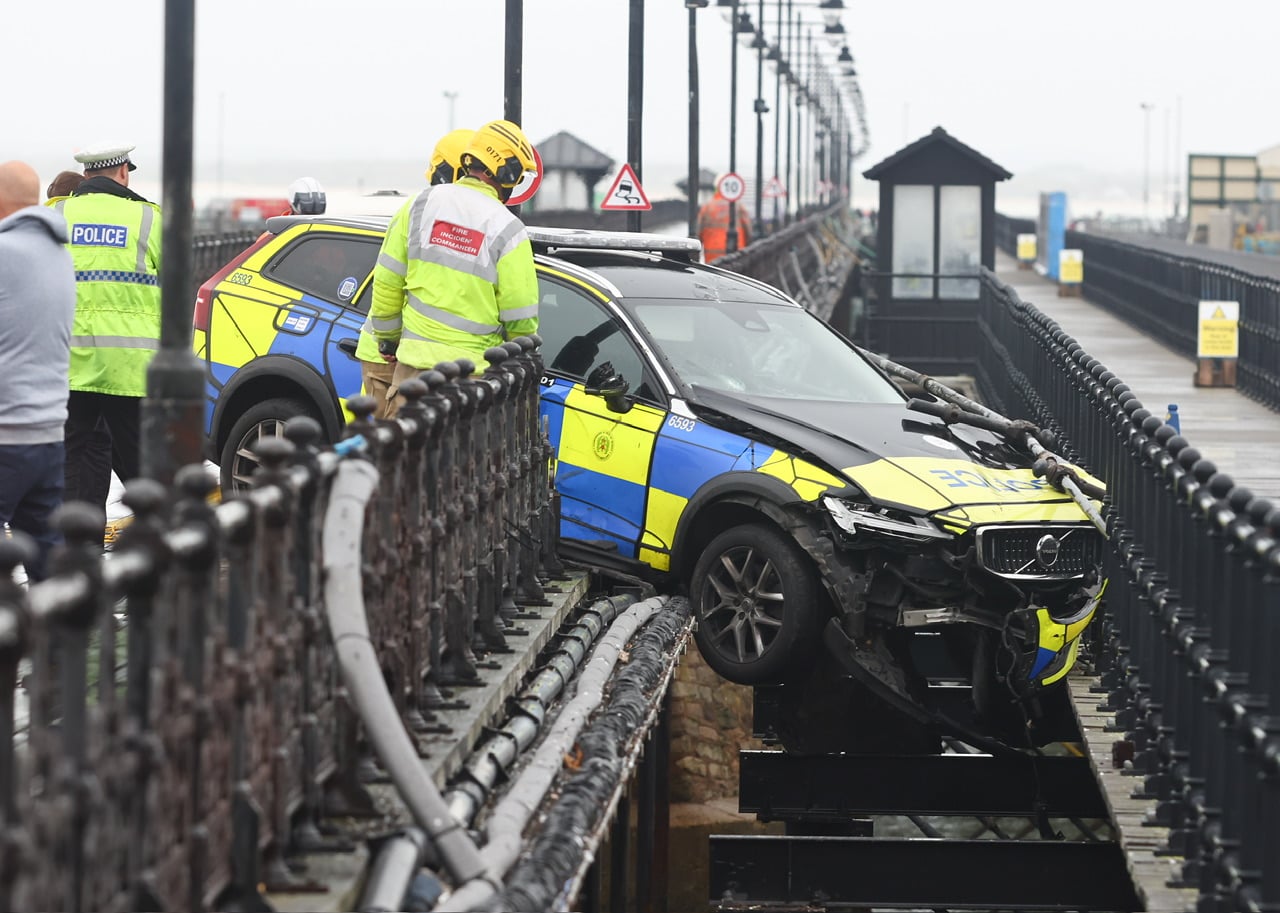 POLICE OFFICERS TRAPPED AS RESPONSE CAR HANGS OFF RYDE PIER
