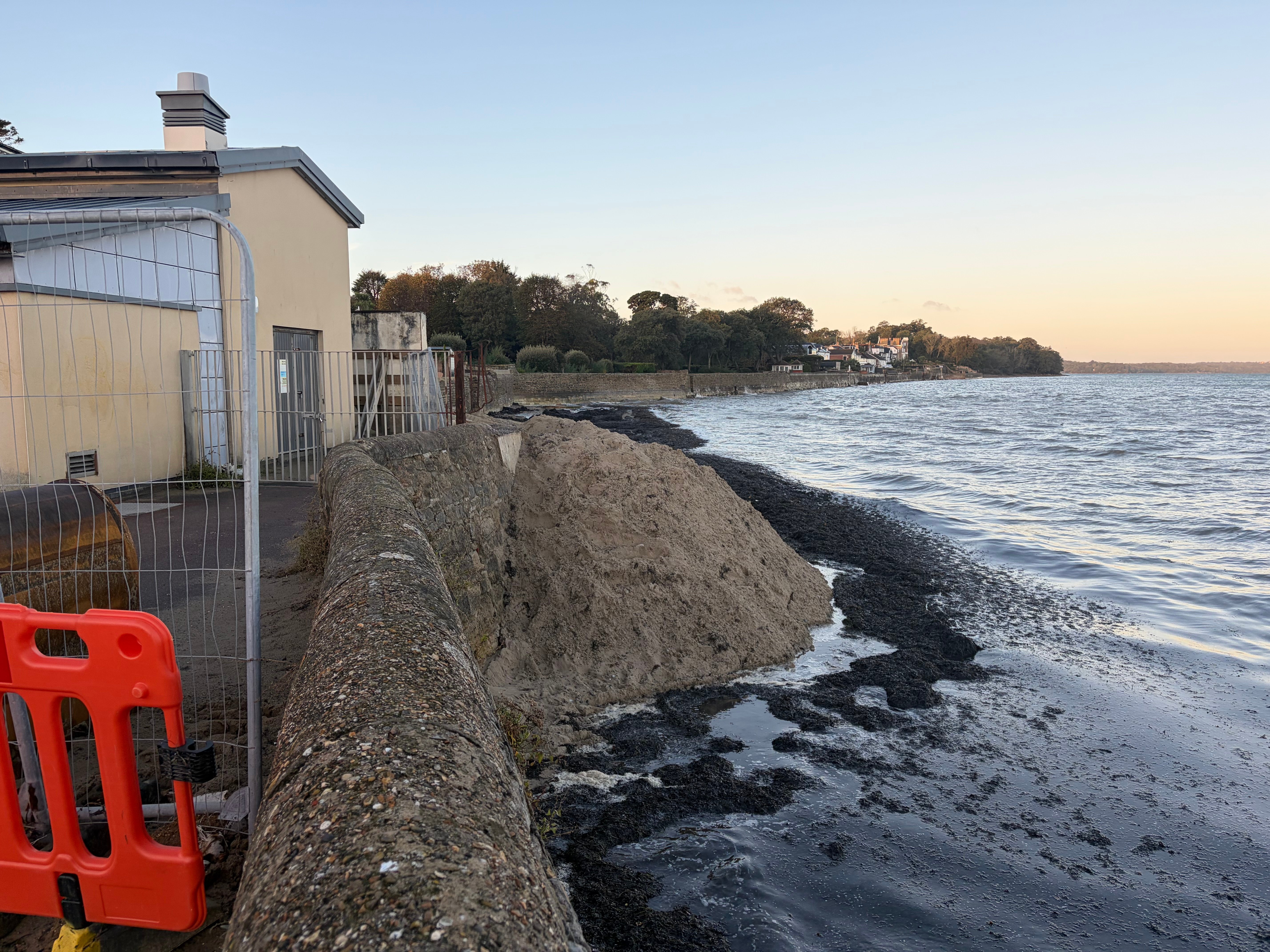 ROCKS AND SAND PROTECTING RYDE PUMPING STATION AS REPLACEMENT WALL AWAITED